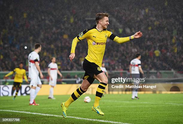 Marco Reus of Borussia Dortmund celebrates as he scores their first goal during the DFB Cup Quarter Final match between VfB Stuttgart and Borussia...