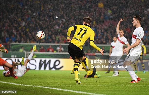 Marco Reus of Borussia Dortmund scores their first goal during the DFB Cup Quarter Final match between VfB Stuttgart and Borussia Dortmund at...