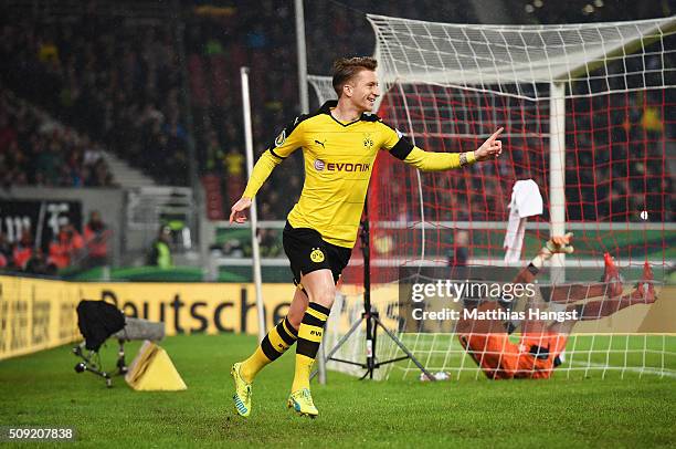 Marco Reus of Borussia Dortmund celebrates as he scores their first goal during the DFB Cup Quarter Final match between VfB Stuttgart and Borussia...