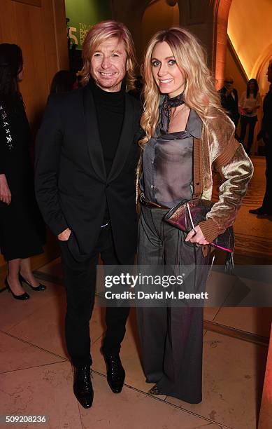 Nicky Clarke and Kelly Simpkin attend a private view of "Vogue 100: A Century of Style" hosted by Alexandra Shulman and Leon Max at the National...