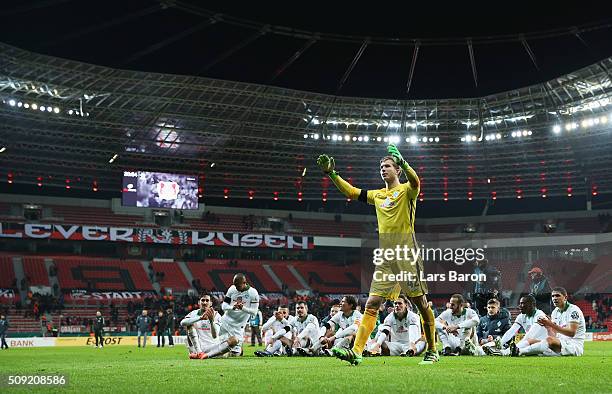 Goalkeeper Felix Wiedwald of Werder Bremen celebrates victory with team mates after the DFB Cup Quarter Final match between Bayer Leverkusen and...