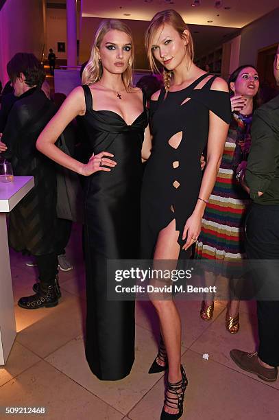 Lily Donaldson and Karlie Kloss attend a private view of "Vogue 100: A Century of Style" hosted by Alexandra Shulman and Leon Max at the National...