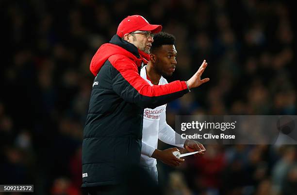 Jurgen Klopp, manager of Liverpool talks to substitute Daniel Sturridge of Liverpool during the Emirates FA Cup Fourth Round Replay match between...