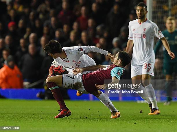 Joao Teixeira of Liverpool competes with Joey O'Brien of West Ham United during the The Emirates FA Cup Fourth Round Replay match between West Ham...