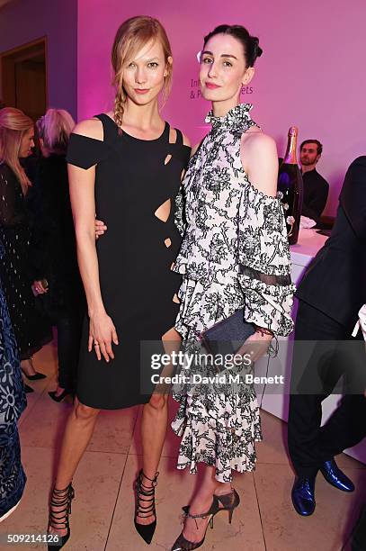 Karlie Kloss and Erin O'Connor attend a private view of "Vogue 100: A Century of Style" hosted by Alexandra Shulman and Leon Max at the National...