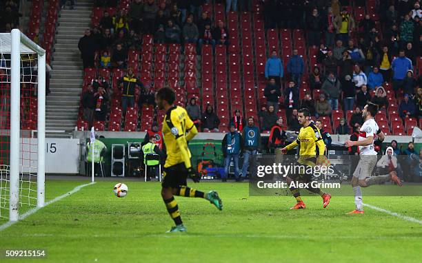 Henrikh Mkhitaryan of Borussia Dortmund scores their third goal during the DFB Cup Quarter Final match between VfB Stuttgart and Borussia Dortmund at...