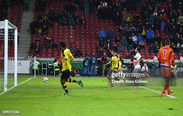 Henrikh Mkhitaryan of Borussia Dortmund scores their third goal during the DFB Cup Quarter Final match between VfB Stuttgart and Borussia Dortmund at...