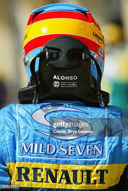 Fernando Alonso of Spain and Renault wears the HANS safety device during practice for the Bahrain F1 Grand Prix at the Bahrain Racing Circuit on...