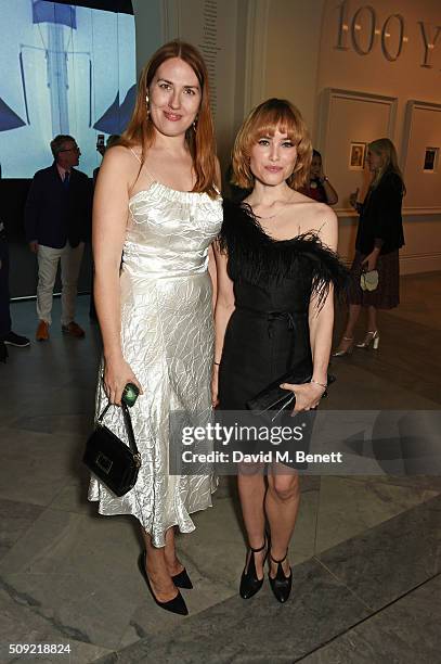 Naomi Smart and Julia Hobbs attend a private view of "Vogue 100: A Century of Style" hosted by Alexandra Shulman and Leon Max at the National...