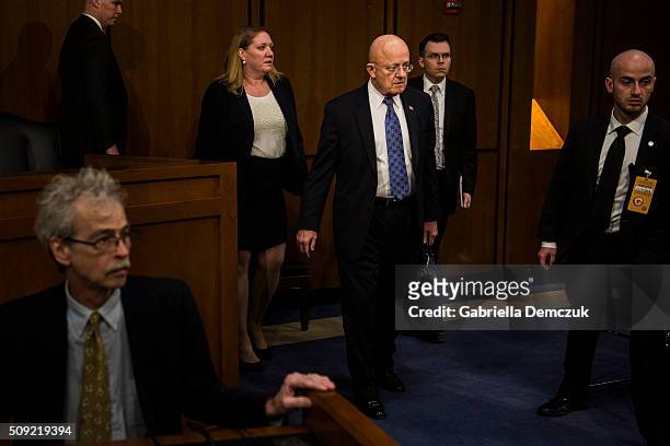 Director of National Intelligence James Clapper enters the room before the Senate Intelligence Committee hearing at the Hart Senate Building on...