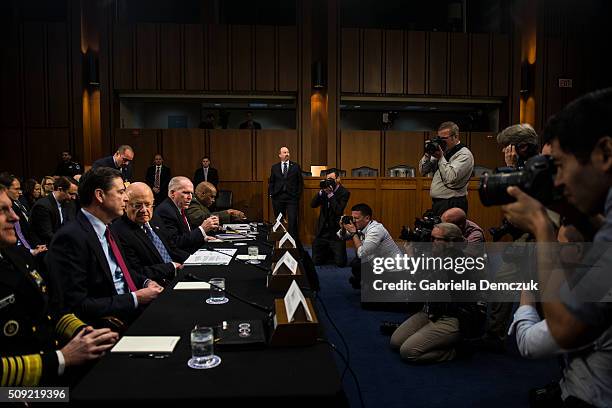 Left to right, National Security Agency Director Adm. Michael Rogers, FBI Director James Comey, Director of National Intelligence James Clapper, CIA...