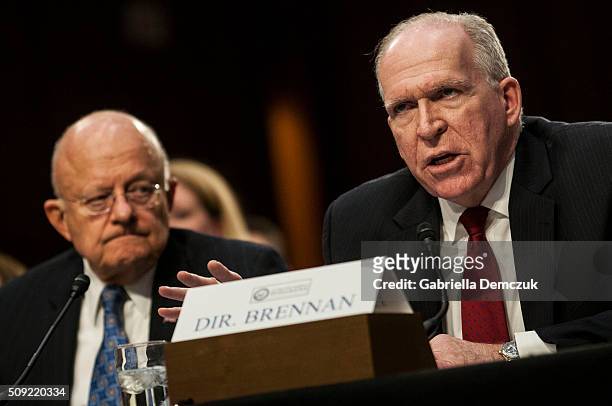 Director John Brennan, along with Director of National Intelligence James Clapper, testifies before the Senate Intelligence Committee at the Hart...