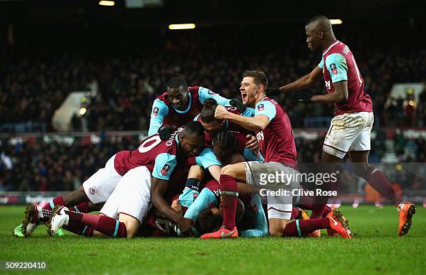 Angelo Ogbonna Obinza of West Ham United is mobbed in celebration by team mates as he scores their second goal during the Emirates FA Cup Fourth...