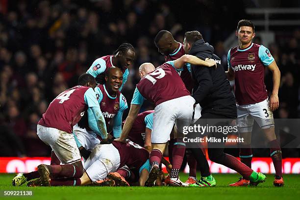 Angelo Ogbonna Obinza of West Ham United celebrates with team mates as he scores their second goal during the Emirates FA Cup Fourth Round Replay...