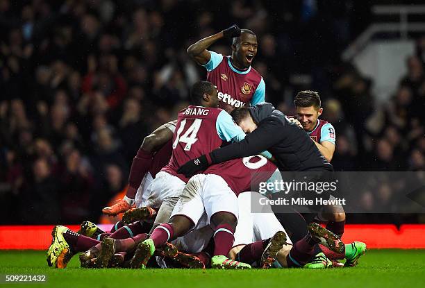 Angelo Ogbonna Obinza of West Ham United is mobbed in celebration by team mates as he scores their second goal during the Emirates FA Cup Fourth...