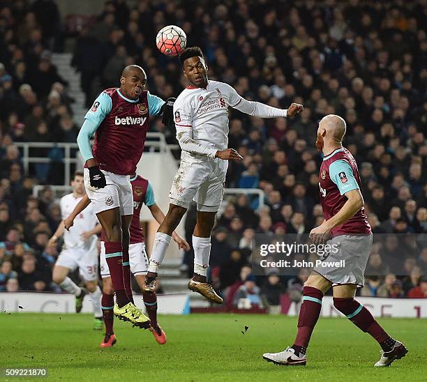 Daniel Sturridge of Liverpool competes with Angelo Ogbonna Obinze of West Ham United during the The Emirates FA Cup Fourth Round Replay match between...