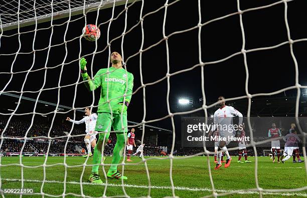 Goalkeeper Darren Randolph of West Ham United reacts as Philippe Coutinho of Liverpool scores their first goal from a free kick during the Emirates...