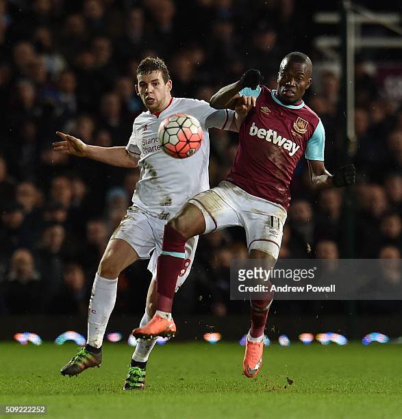 Jon Flanagan of Liverpool competes with Enner Valencia of West Ham United United during the The Emirates FA Cup Fourth Round Replay match between...