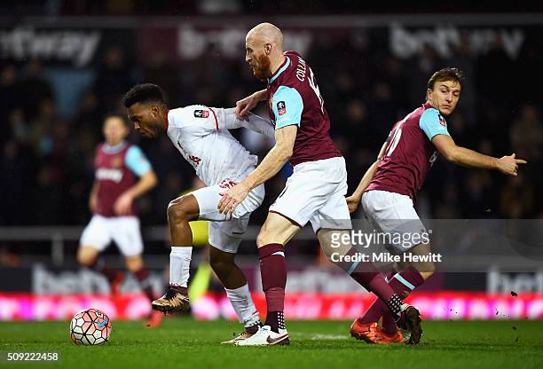 Daniel Sturridge of Liverpool is closed down by James Collins of West Ham United as Mark Noble of West Ham United looks on during the Emirates FA Cup...