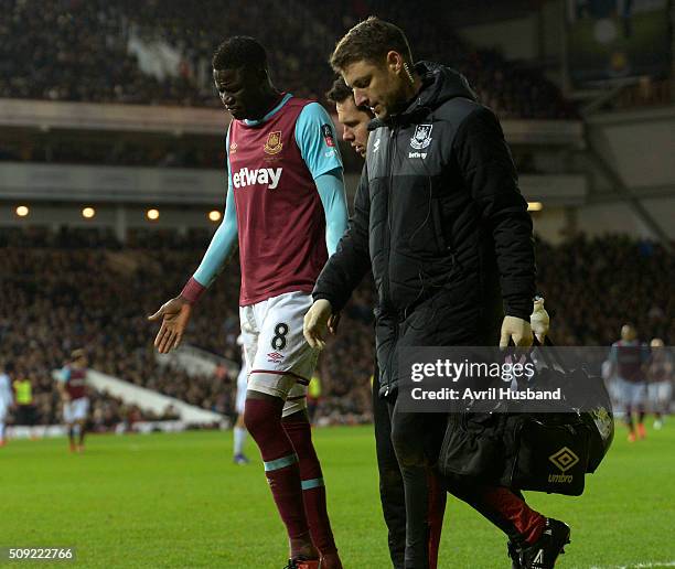 Cheikhou Kouyate of West Ham United goes off injured during the Emirates FA Cup Fourth Round Replay between West Ham United and Liverpool at Boleyn...