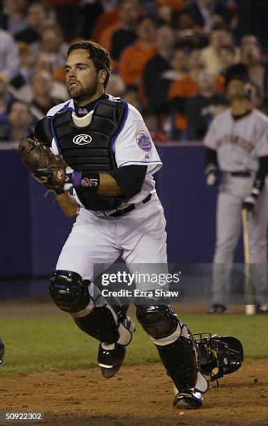 Mike Piazza of the New York Mets runs back for a pop fly behind home plate during the game against the San Francisco Giants on May 6, 2004 at Shea...