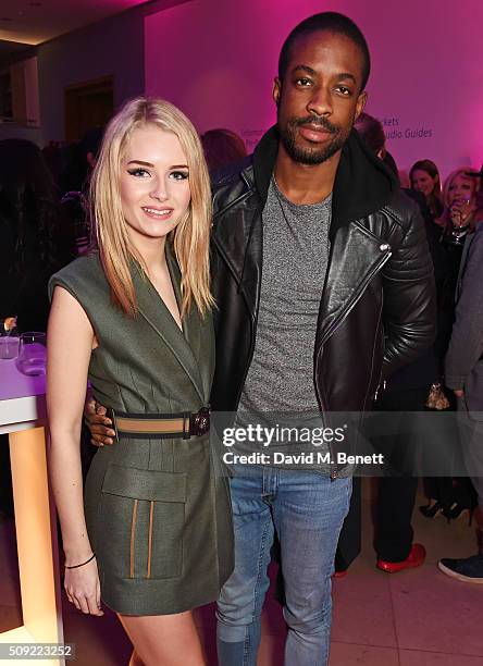 Lottie Moss and Emmanuel Ezugwu attend a private view of "Vogue 100: A Century of Style" hosted by Alexandra Shulman and Leon Max at the National...
