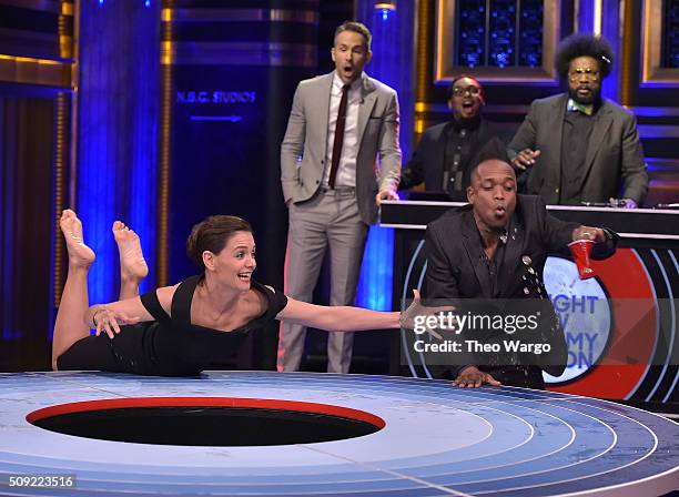 Katie Holmes, Kirk Douglas of The Roots, Ryan Reynolds and Questlove play a game of "Musical Beers" during a taping of "The Tonight Show Starring...