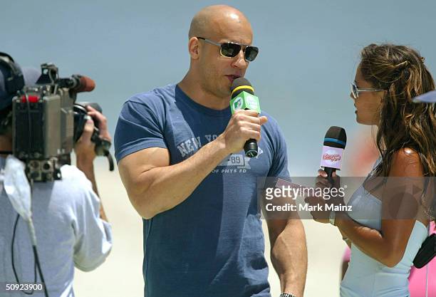 Actor Vin Diesel and MTV VJ Vanessa Minnillo attend MTV's "TRL Beach House: Summer on the Run" on June 3, 2004 in Long Beach, California.