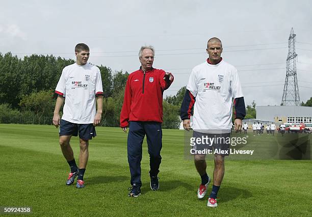 England manager, Sven Goran Eriksson with Steven Gerrard and David Beckham of England walks onto the Carrington training complex owned by Manchester...