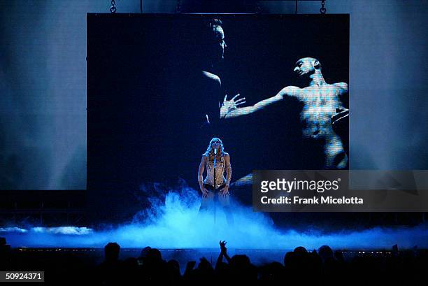 Singer/actress Madonna performs onstage during her "Re-Invention" World Tour 2004 at the Arrowhead Pond, June 3, 2004 in Anaheim, California. The...