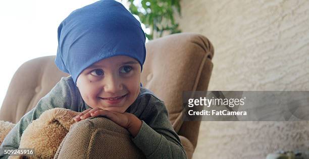 little boy with cancer in the hospital - childhood cancer stock pictures, royalty-free photos & images