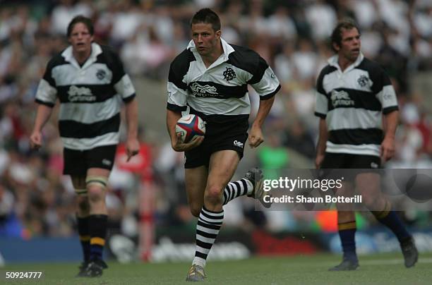 Bobby Skinstad of the Barbarians runs in an interception try during the match between England and the Barbarians at Twickenham on May 30, 2004 in...