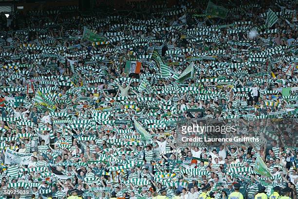 Celtic fans celebrate after the 119th Scottish Tennents Cup Final between Celtic and Dunfermline held at Hampden Park on May 22, 2004 in Glasgow,...
