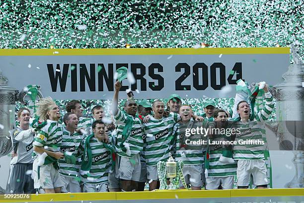 The Celtic team celebrate with the trophy after winning the 119th Scottish Tennents Cup Final between Celtic and Dunfermline held at Hampden Park on...