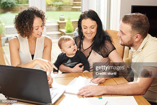 financial advisor gets the signature - alliance of moms presents raising baby stockfoto's en -beelden