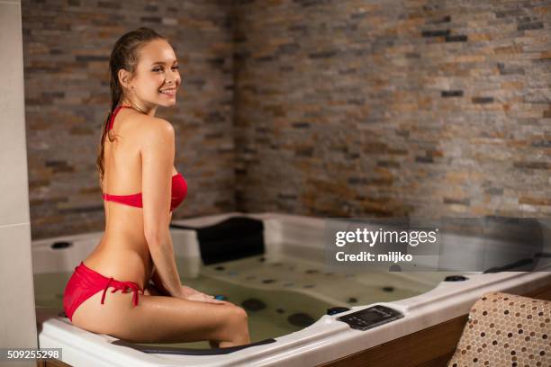 young woman in spa bath - balneotherapy stock pictures, royalty-free photos & images