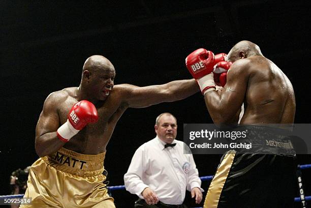 Matt Skelton lands a left on Michael Sprott during their British and Commonwealth Heavyweight title fight at the Rivermead Centre on April 24, 2004...
