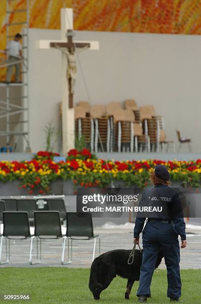 Security guard patrols the area where Pope John Paul II will address faithfuls during his visit to Bern, 04 June 2004. The placid and picturesque...
