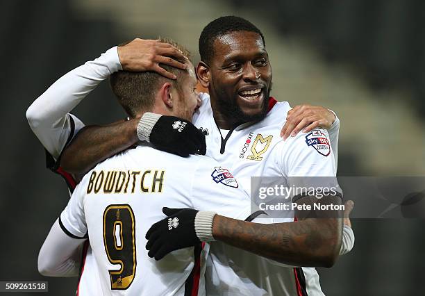 Dean Bowditch of Milton Keynes Dons is congratulated by team mate Jay Emmanuel-Thomas after scoring his sides goal during the Sky Bet Championship...