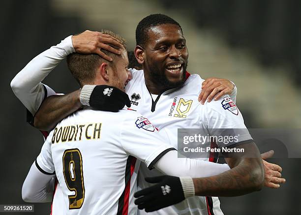 Dean Bowditch of Milton Keynes Dons is congratulated by team mate Jay Emmanuel-Thomas after scoring his sides goal during the Sky Bet Championship...