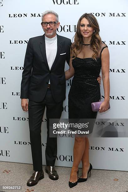Patrick Cox and Liz Hurley attend the opening of Vogue 100 : A Century of Style at National Portrait Gallery on February 9, 2016 in London, England.