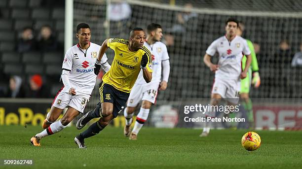 Emillio Nsue of Middlesbrough looks to the ball with Josh Murphy of Milton Keynes Dons during the Sky Bet Championship match between Milton Keynes...