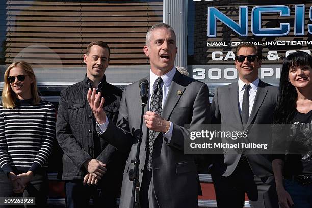 Actors Emily Wickersham and Sean Murray, NCIS Director Andrew Traver and actors Michael Weatherly and Pauley Perrette attend the cake cutting...