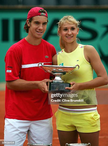 Tatiana Golovin and Richard Gasquet of France celebrate with the trophy after winning their mixed doubles final against Cara and Wayne Black of...