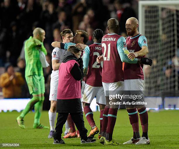 Angelo Ogbonna of West Ham United celebrates at the final whistle during The Emirates FA Cup Fourth Round Replay between West Ham United and...