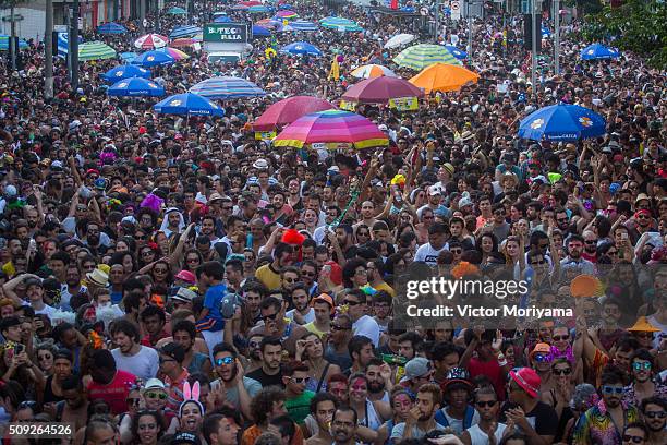 Revellers participate in the Carnival group parade honoring the singer David Bowie through the streets of downtown on February 9, 2016 in Sao Paulo,...