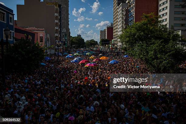 Revellers participate in the Carnival group parade honoring the singer David Bowie through the streets of downtown on February 9, 2016 in Sao Paulo,...