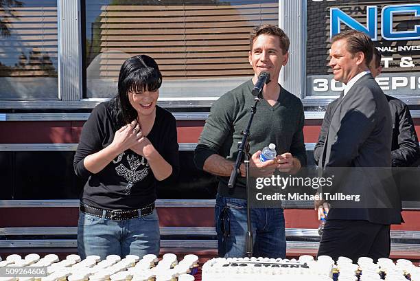 Actors Pauley Perrette, Brian Dietzen and Michael Weatherly attend the cake cutting celebration for "NCIS" 300th episode on February 9, 2016 in...