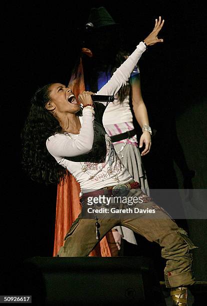 Jada Pinkett Smith -wife of actor Will Smith - and her band "Wicked Wisdom" perform on stage, supporting Britney Spears at the National Indoor Arena...