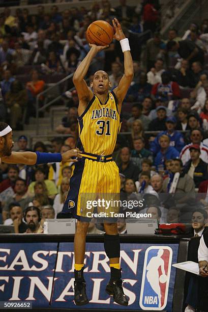 Portrait of Reggie Miller of the Indiana Pacers shoots over Rasheed Wallace of the Detroit Pistons in Game four of the Eastern Conference Finals...